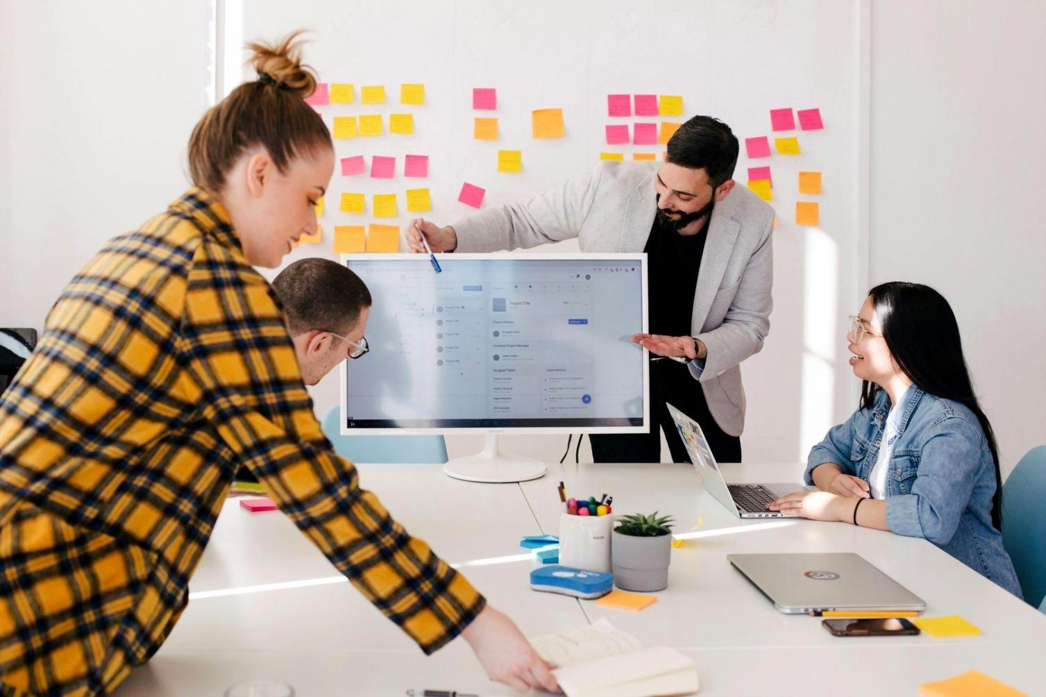 Professional software testing environment showing multiple monitors with code analysis and testing frameworks